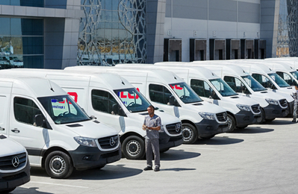 Arab male delivery boy is delivering parcel to an arab woman in hijab or burqa